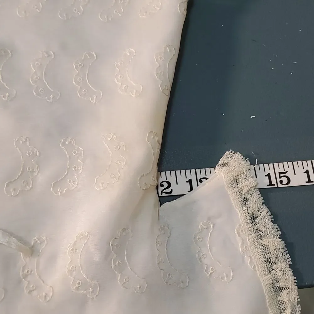 Vintage baby dress with jacket. Trimmed in lace with tie. The jacket has enbroid